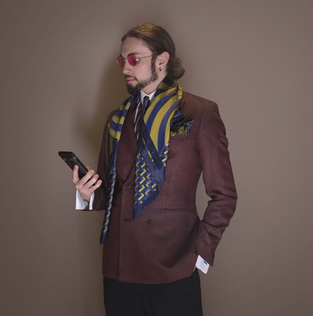Brannoc Whetter demonstrating his personal style with Art Deco Sovereign scarf and pocket square.